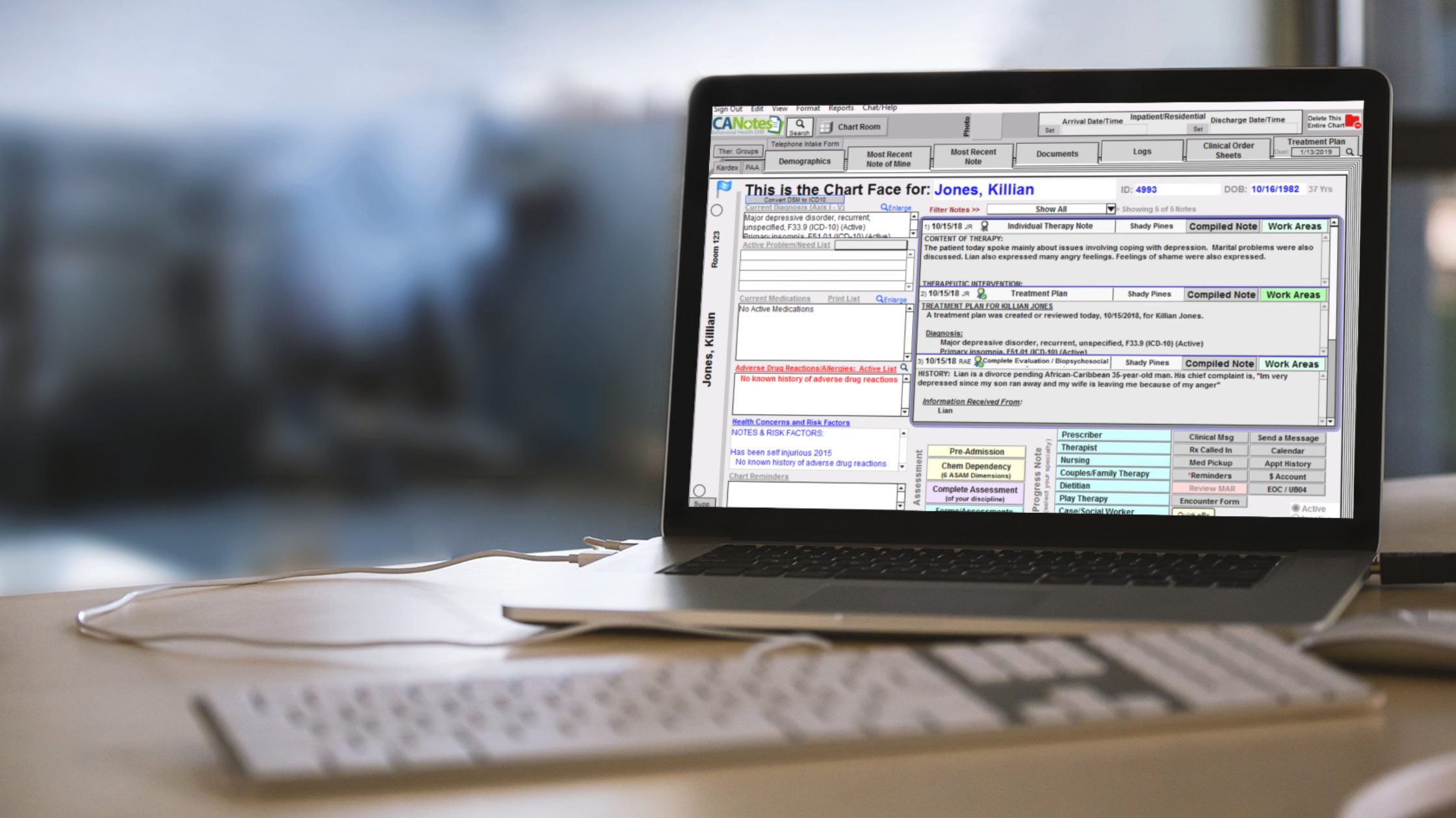 ICANotes psychiatry EHR software on laptop computer