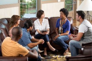 Adults in mental health group therapy doing life skills activities