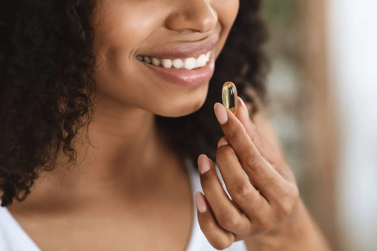 person taking a vitamin