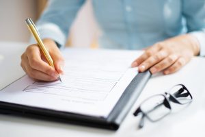 auditor taking notes for joint commission compliance survey
