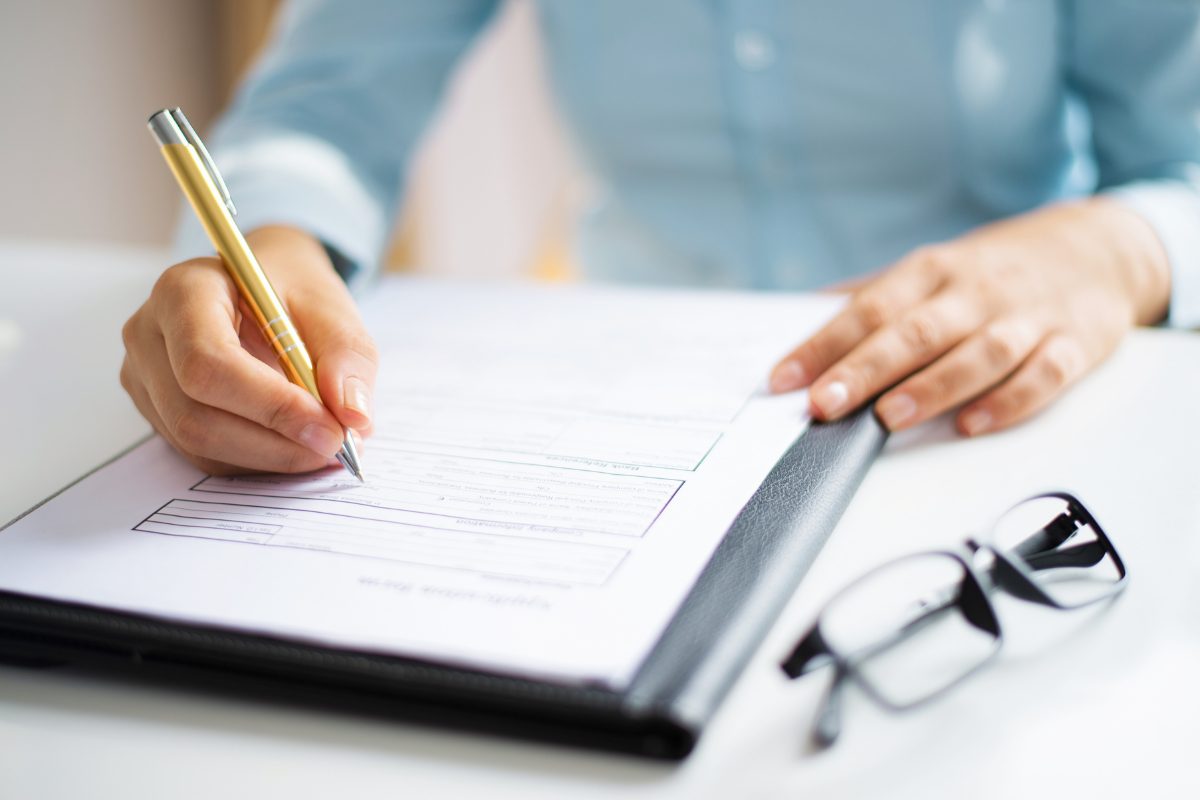 auditor taking notes for joint commission compliance survey