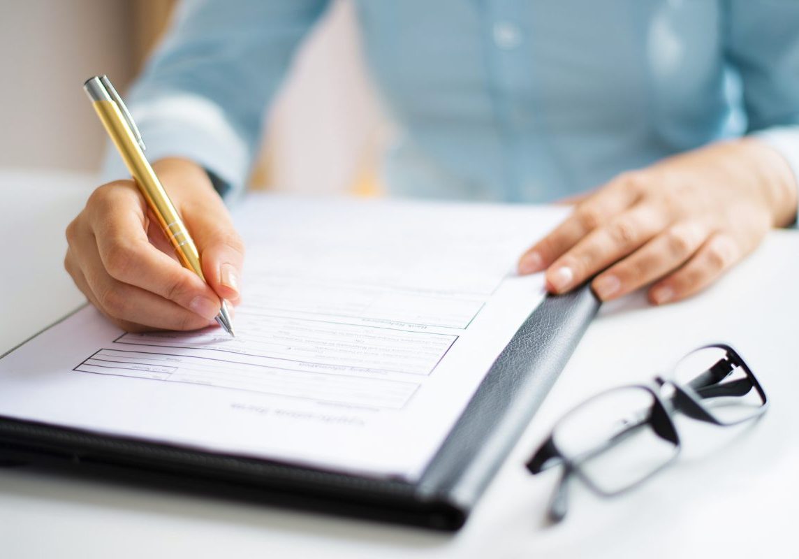 auditor taking notes for joint commission compliance survey