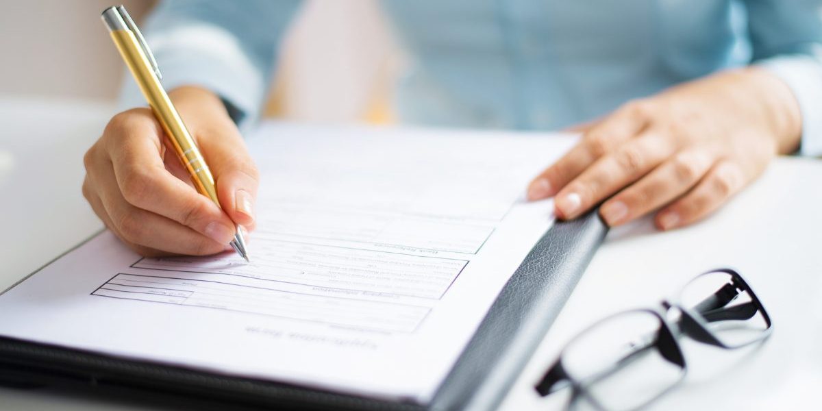 auditor taking notes for joint commission compliance survey